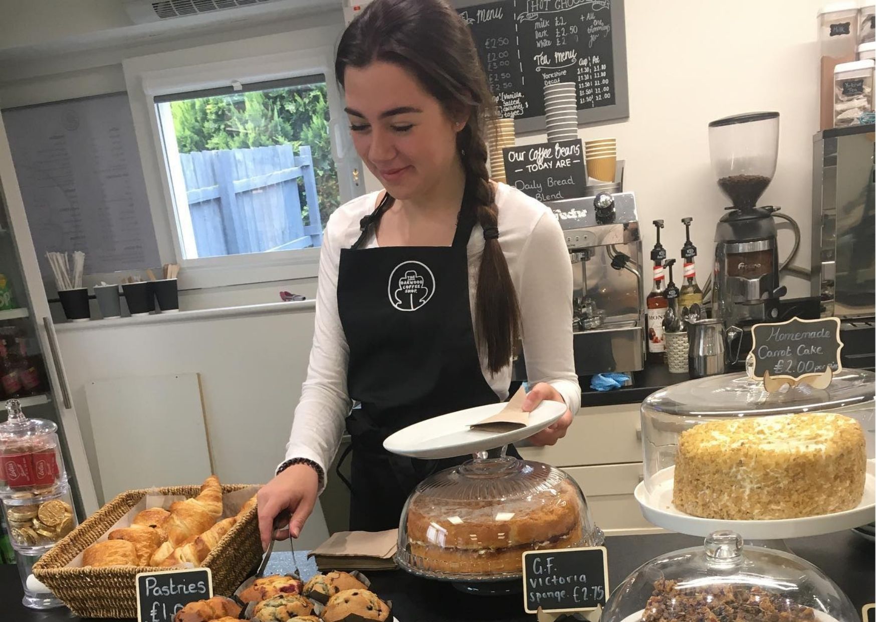 teenage girl serving cakes