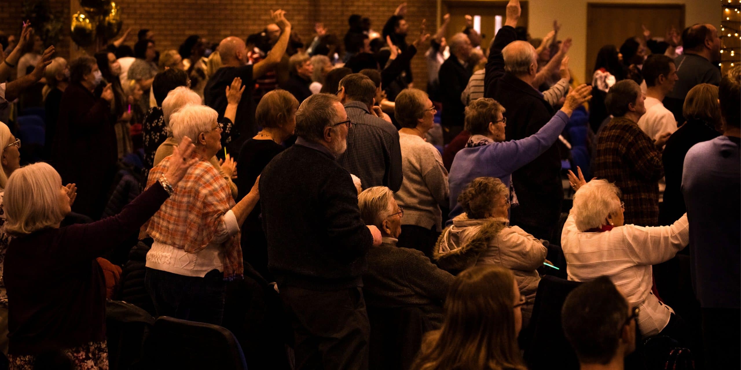 a group of people worshipping