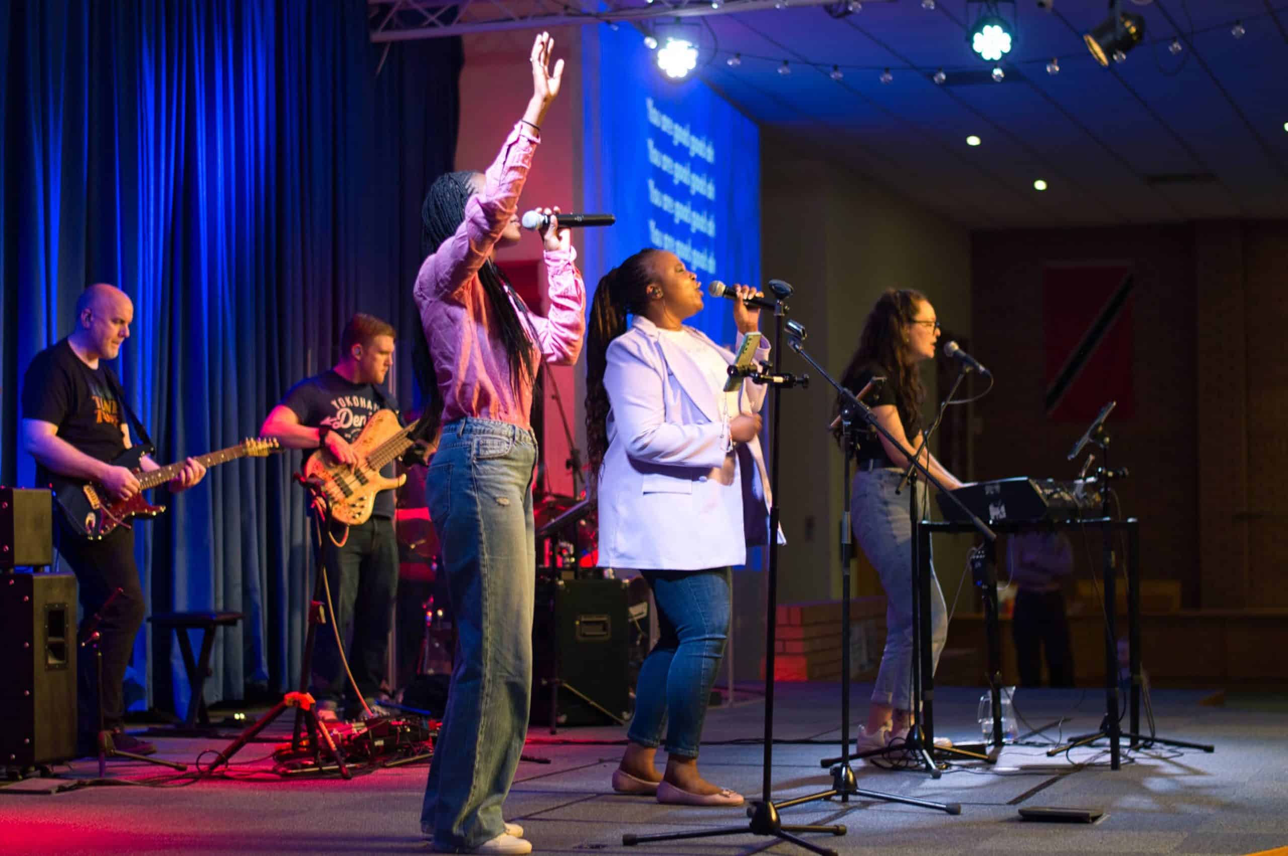 a group of people with instruments and singing