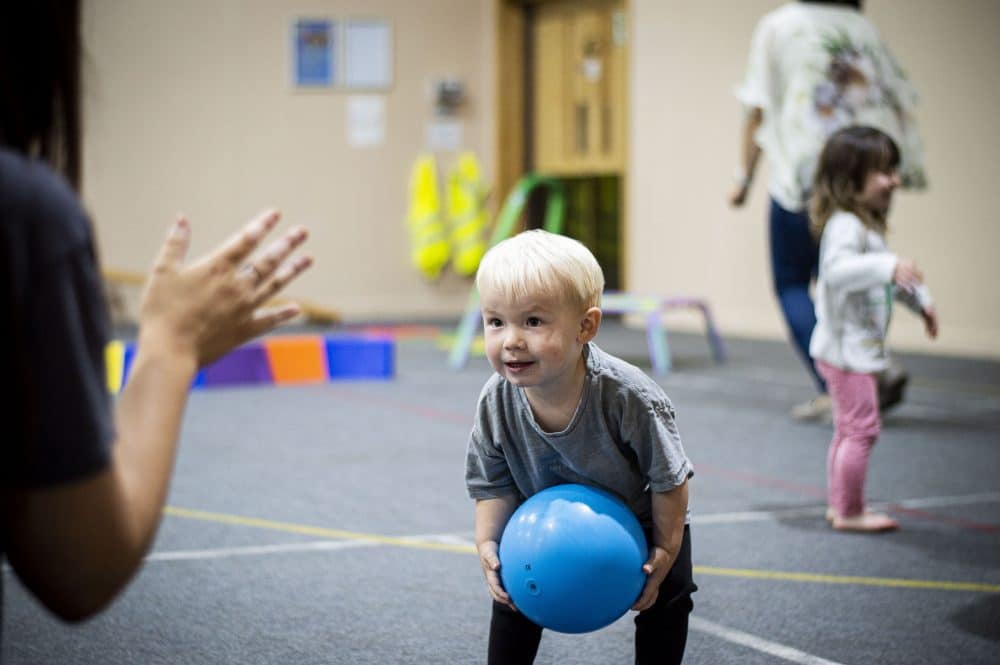 a toddler throwing a ball