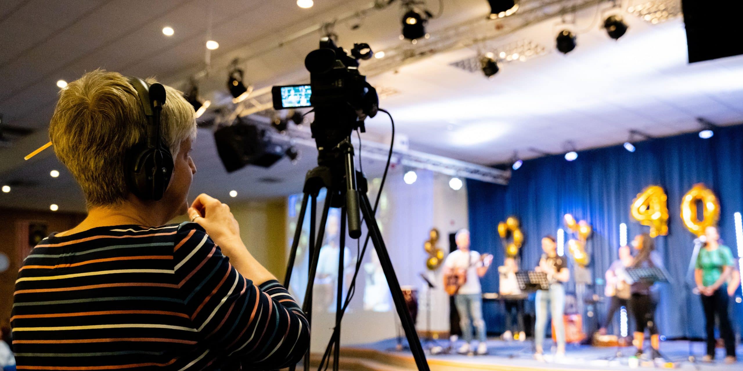 a lady operating a video camera