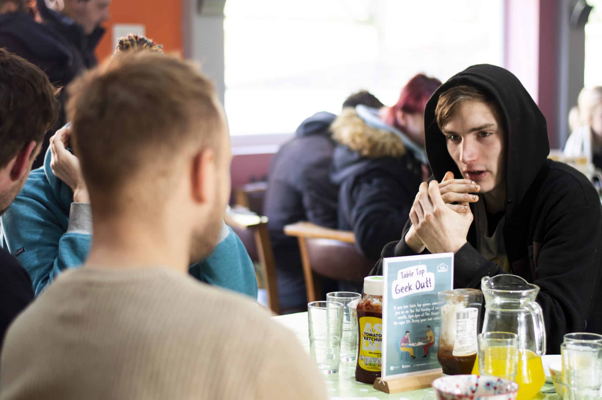two men sitting at a breakfast table